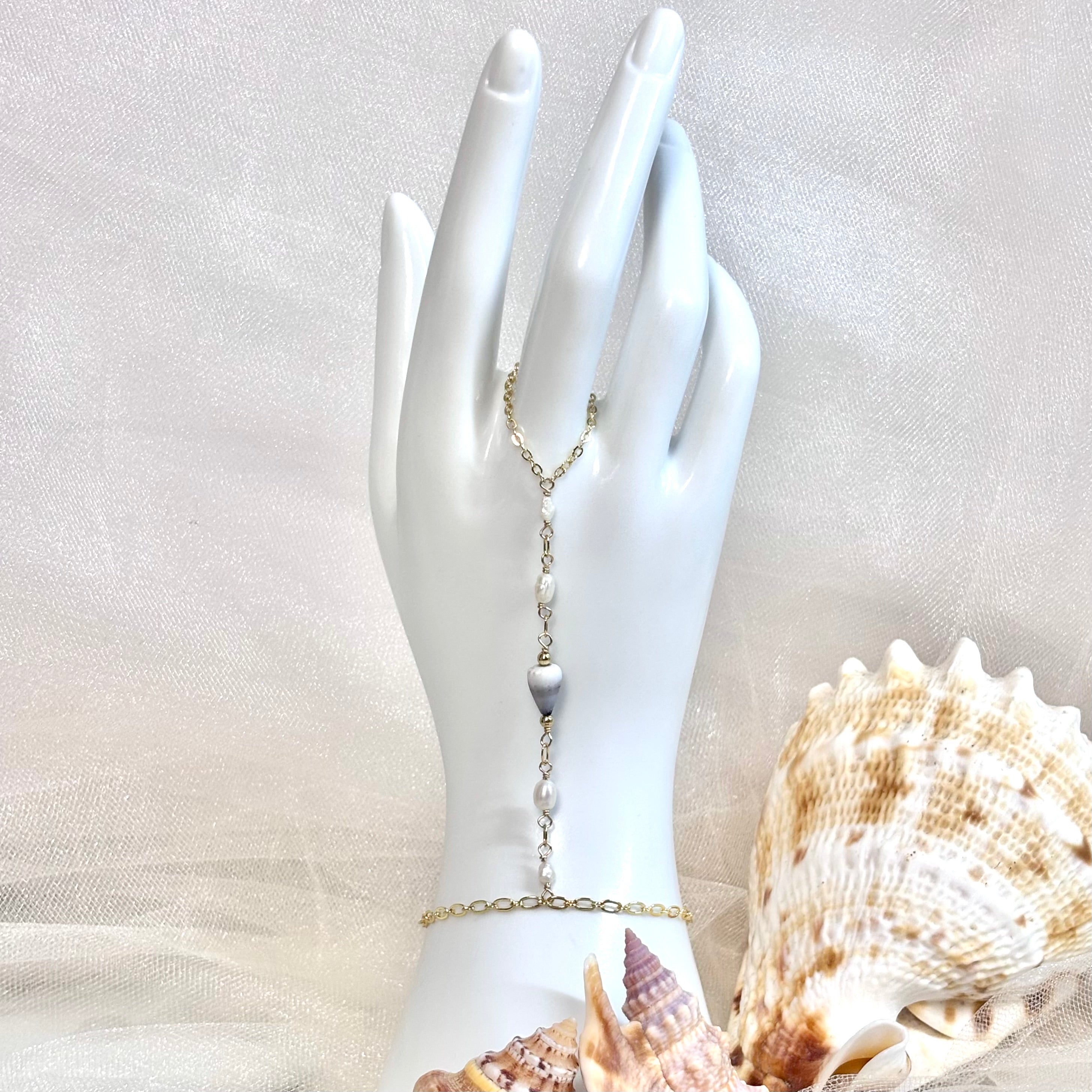 Cone shell handchain w/ white pearls