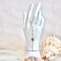 Hebrew cone shell handchain w/ white pearls