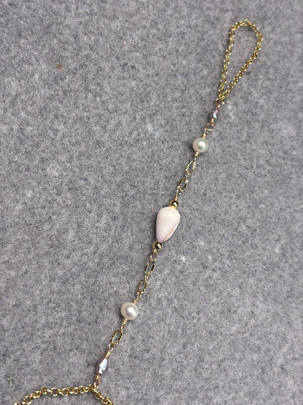 Cone shell handchain w/ white pearls