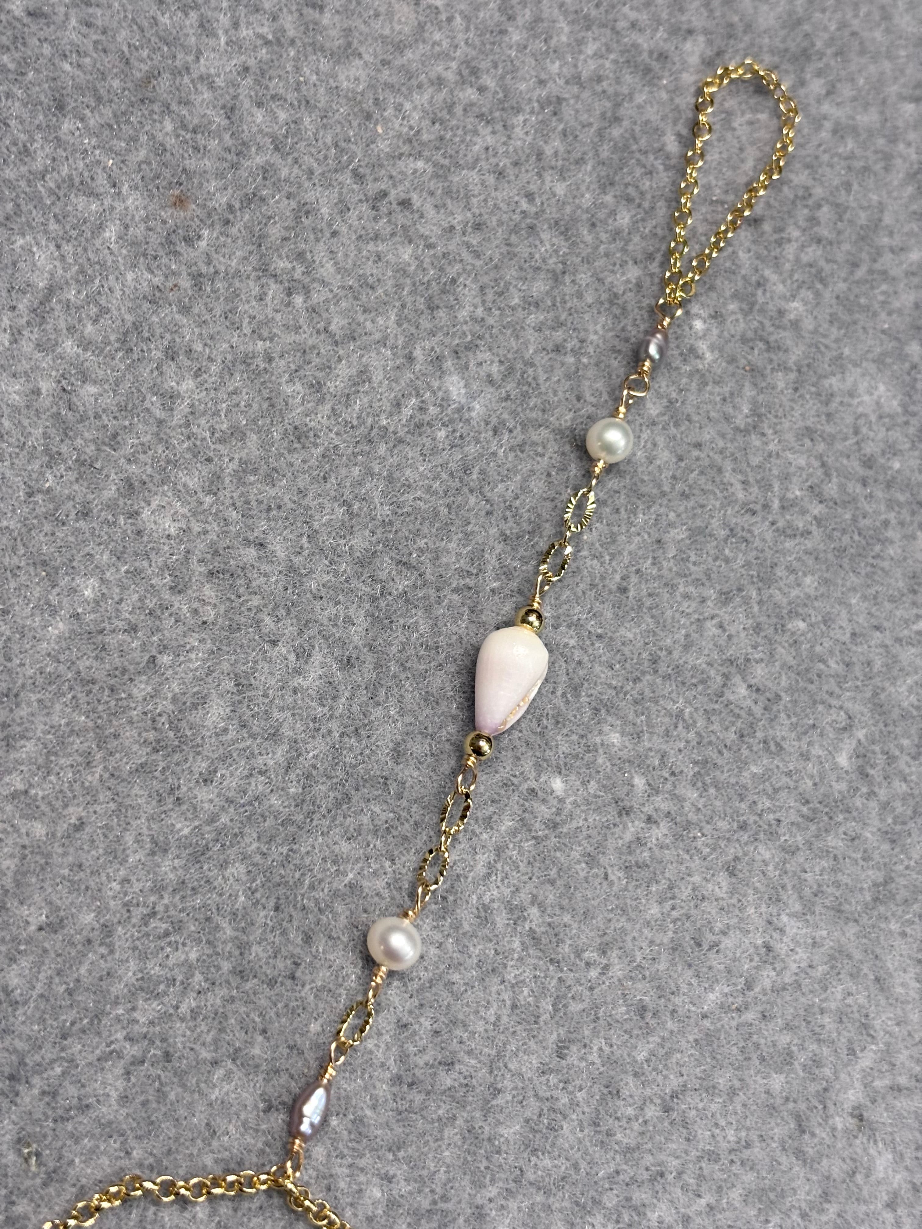 Cone shell handchain w/ white pearls