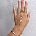 Cone shell handchain w/ white pearls and natural blue beads