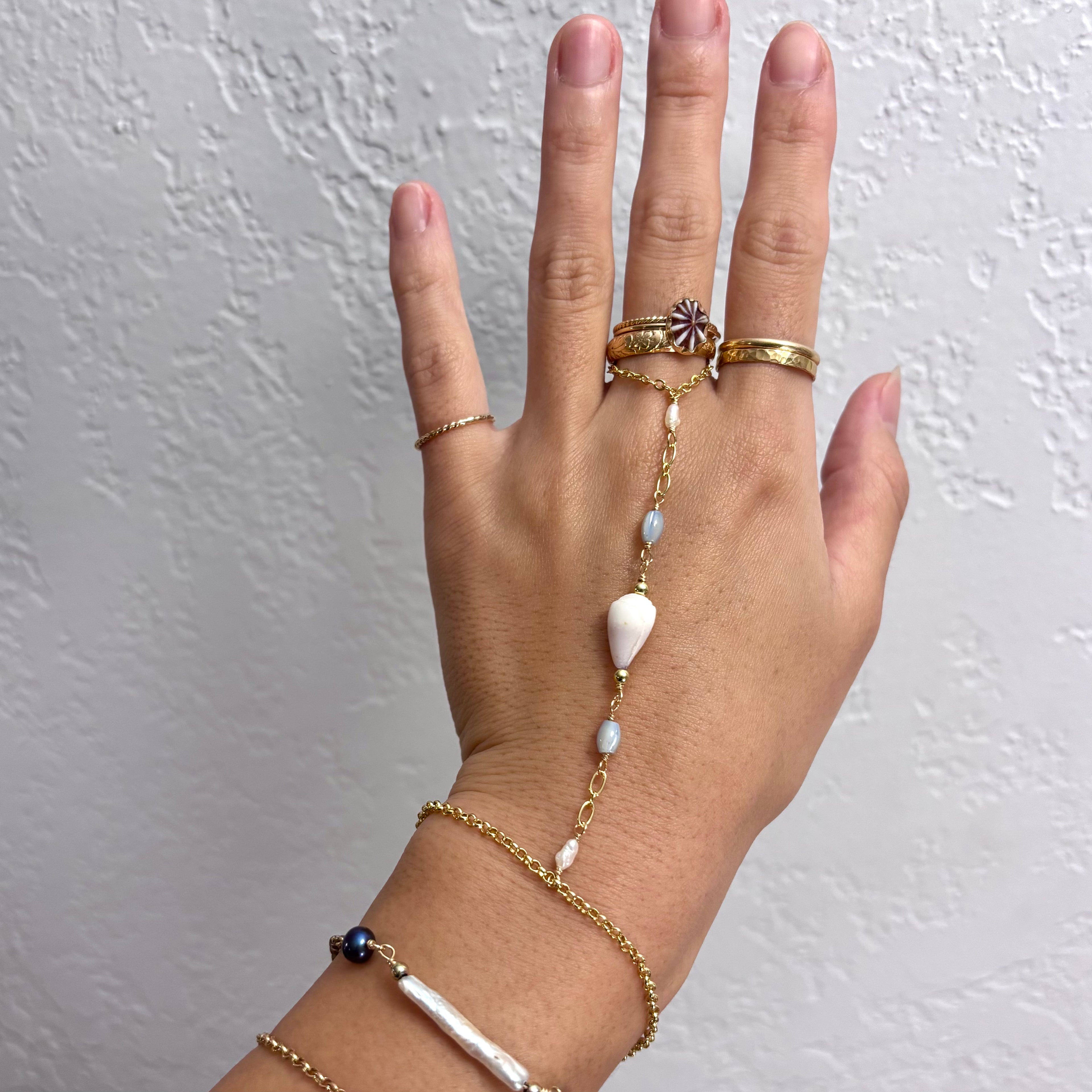 Cone shell handchain w/ white pearls and natural blue beads
