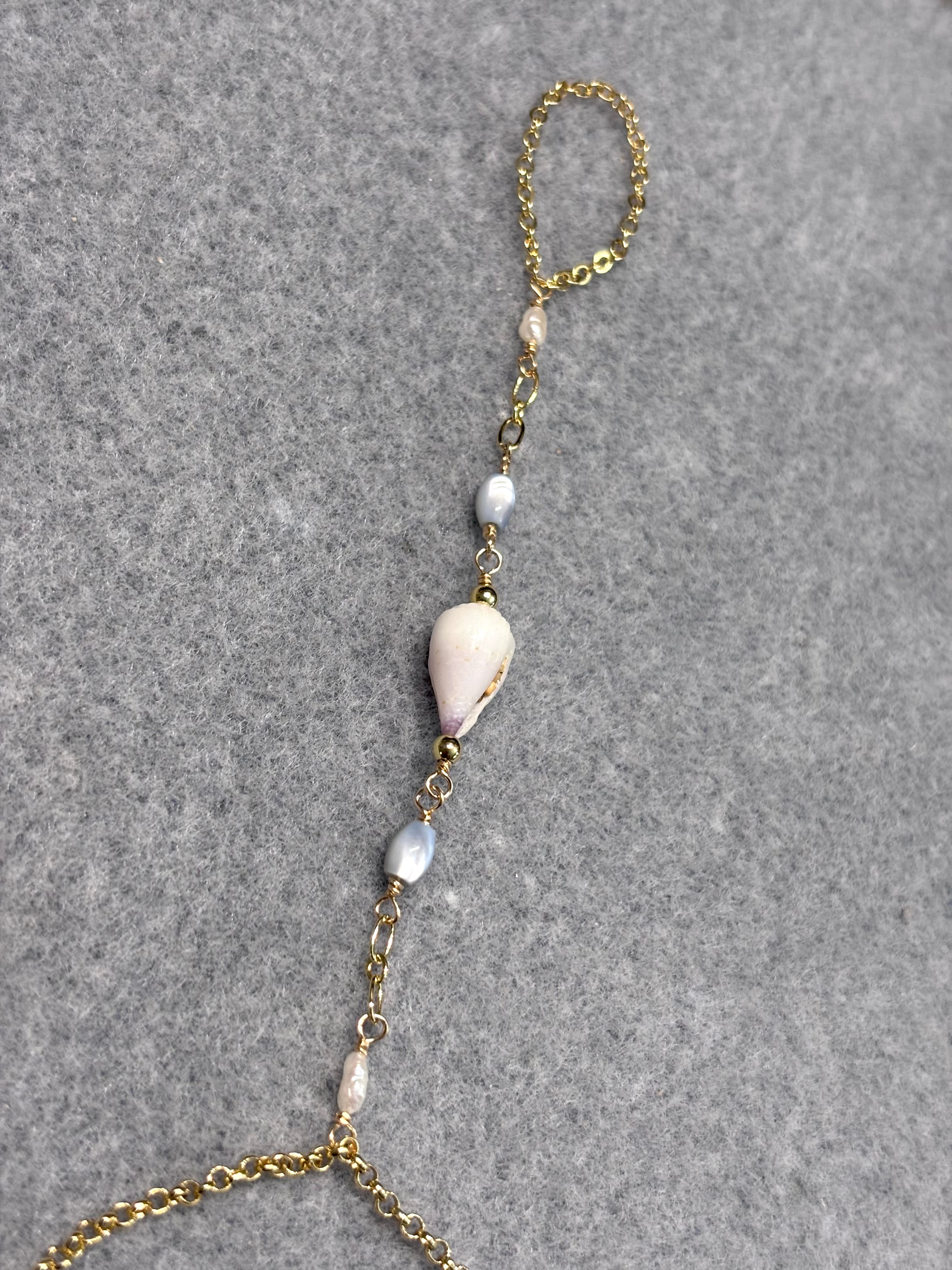 Cone shell handchain w/ white pearls and natural blue beads