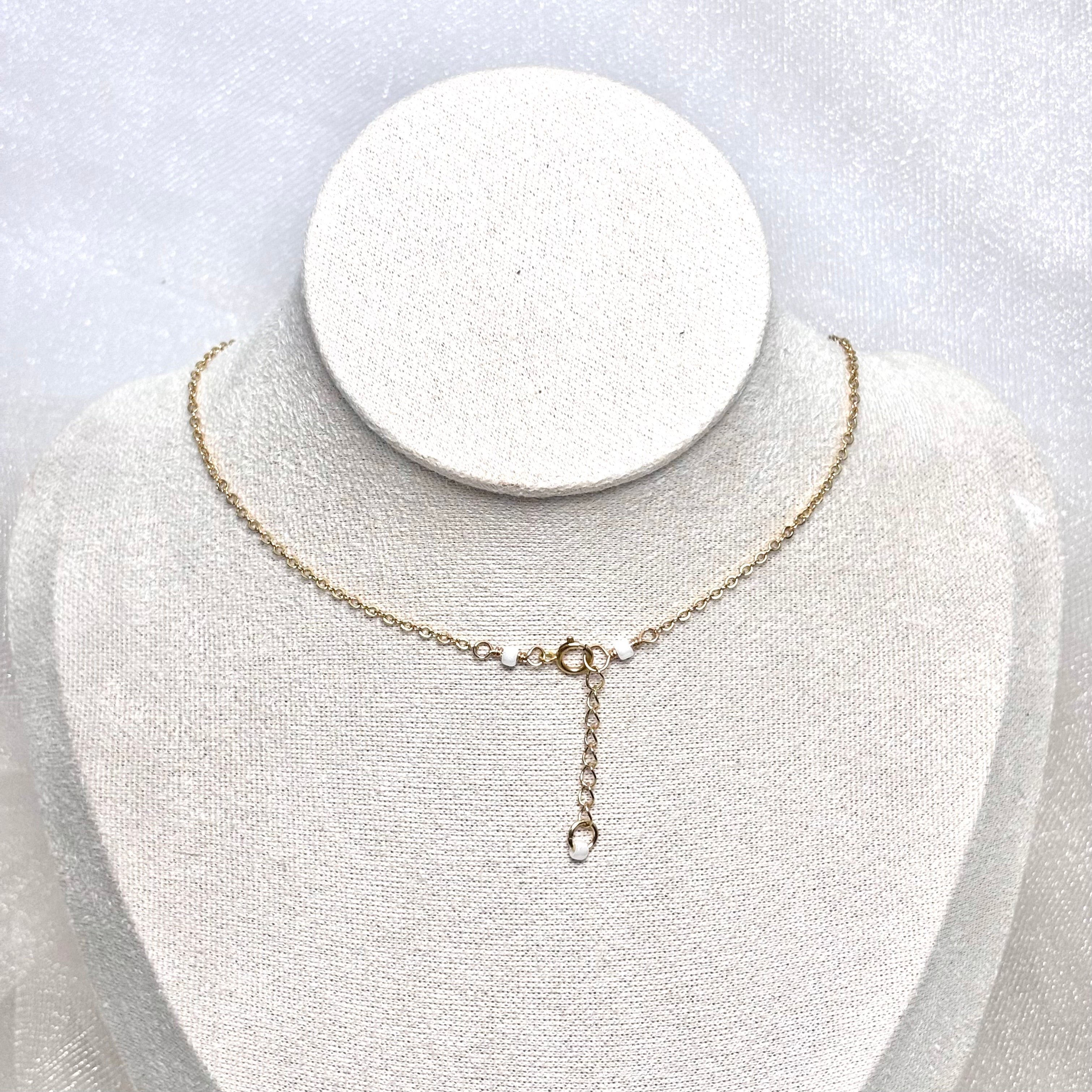 Purple cone shell charm Necklace w/ Pikake and white pearls