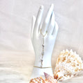 Cone shell handchain w/ light gray pearl