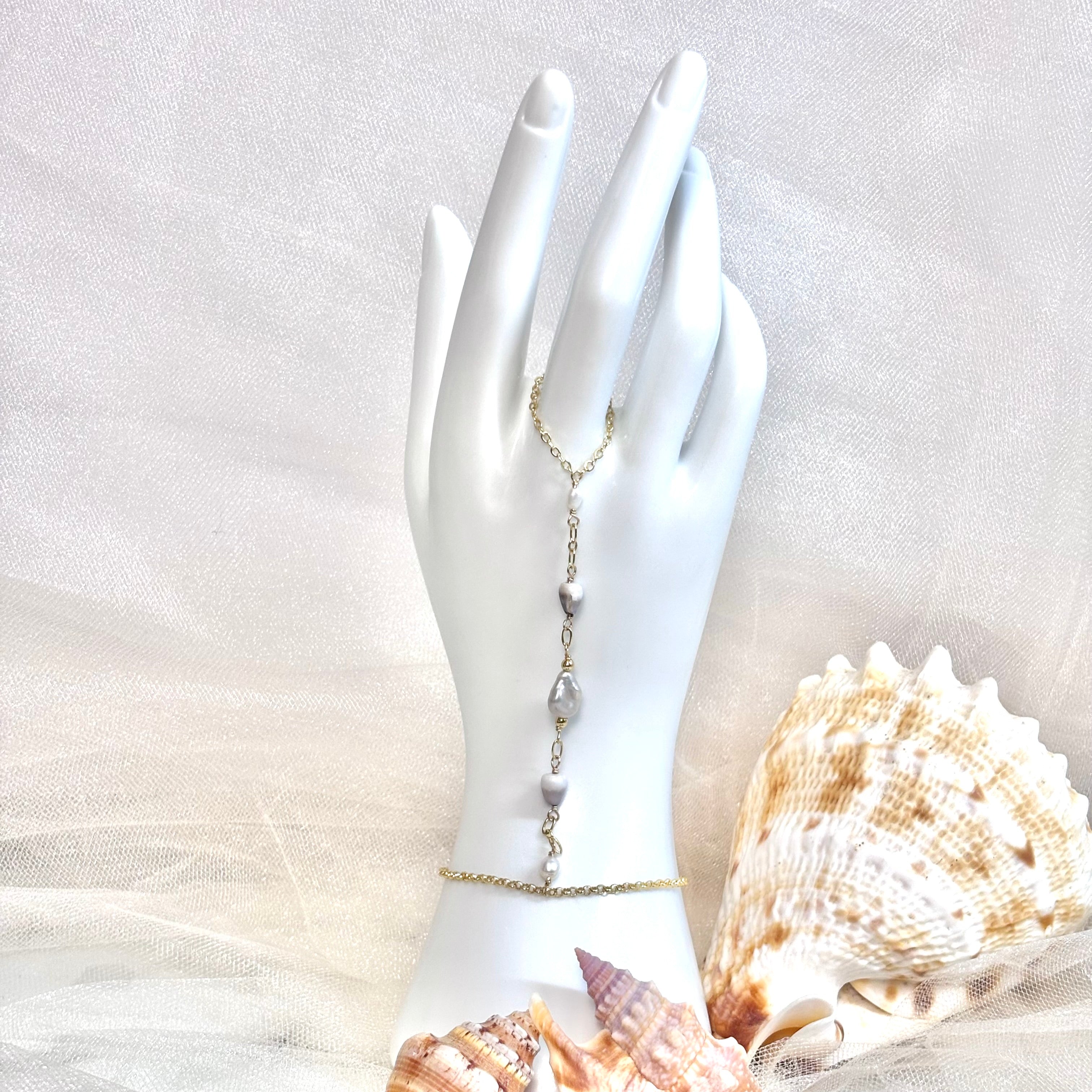 Cone shell handchain w/ light gray pearl