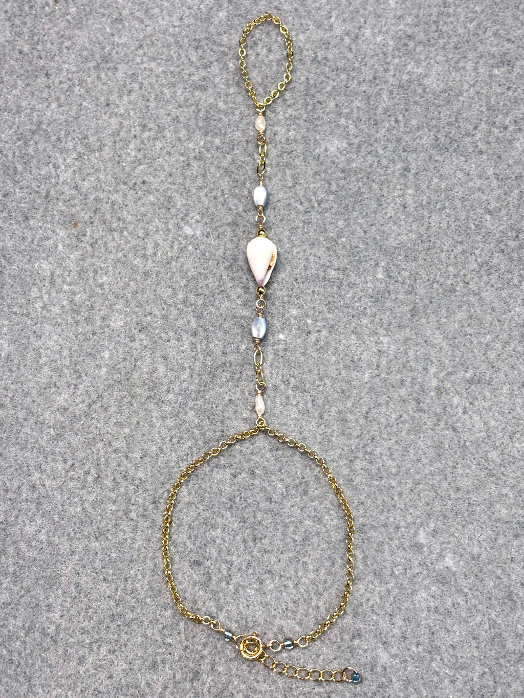 Cone shell handchain w/ white pearls and natural blue beads
