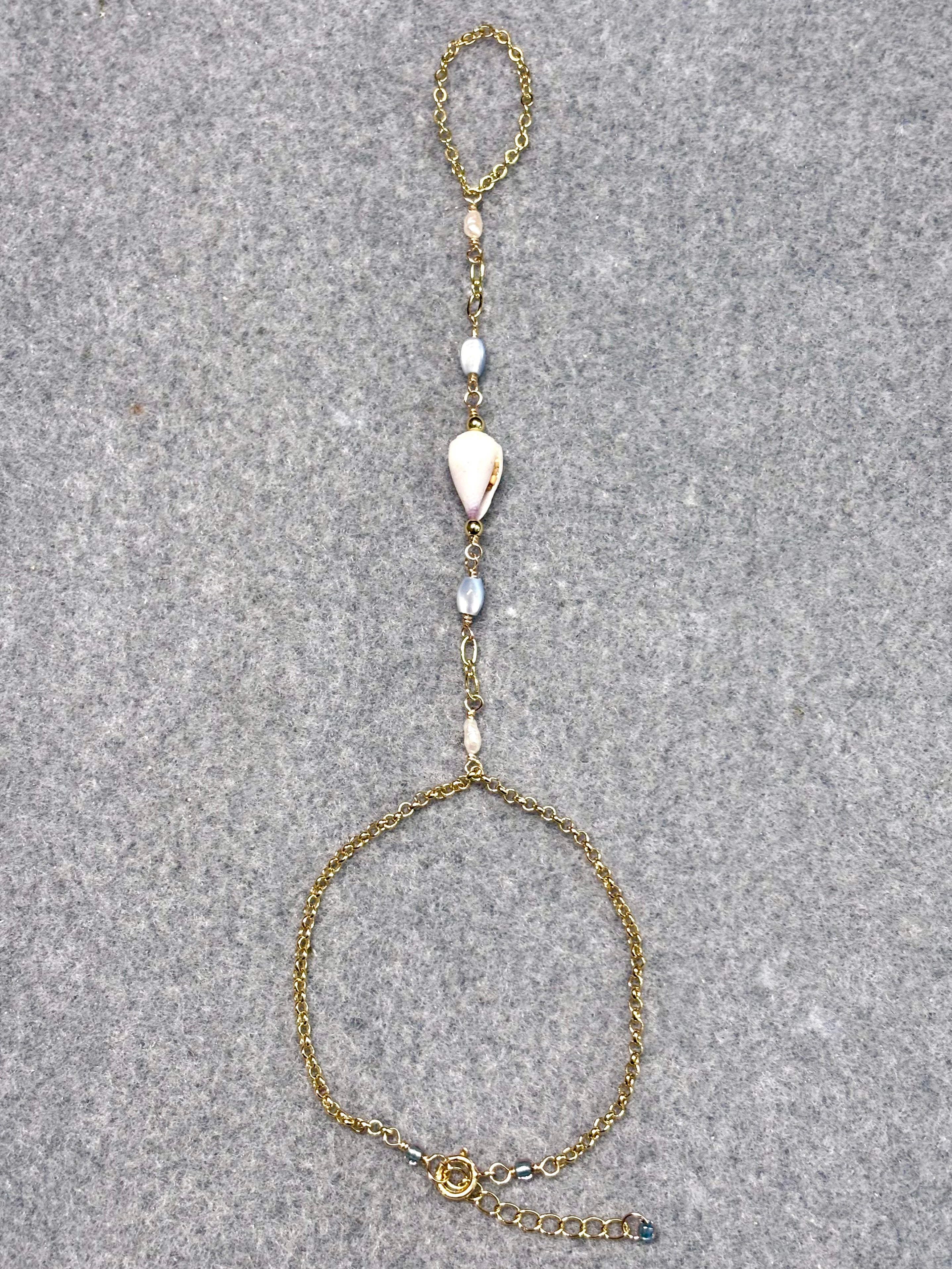 Cone shell handchain w/ white pearls and natural blue beads