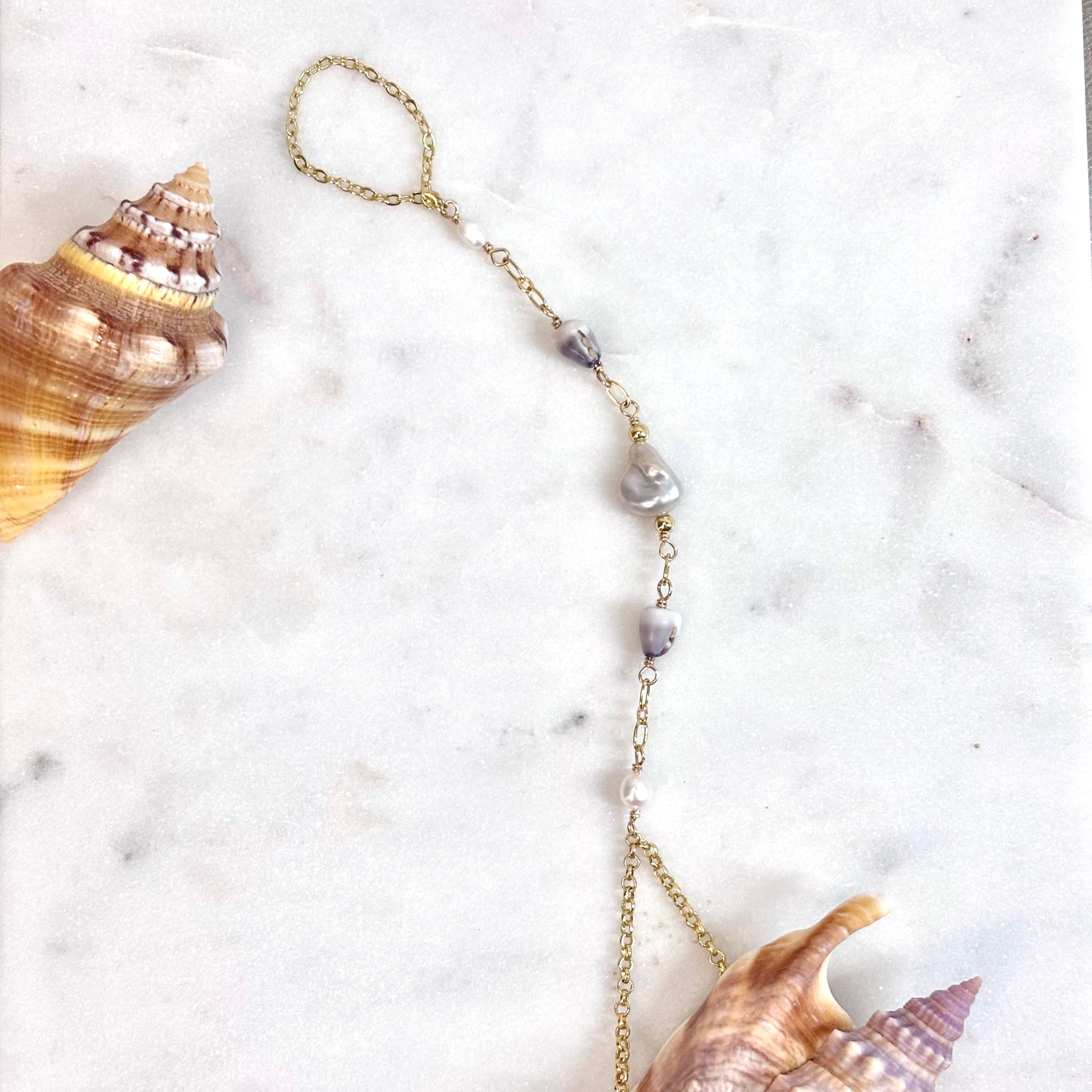 Cone shell handchain w/ light gray pearl