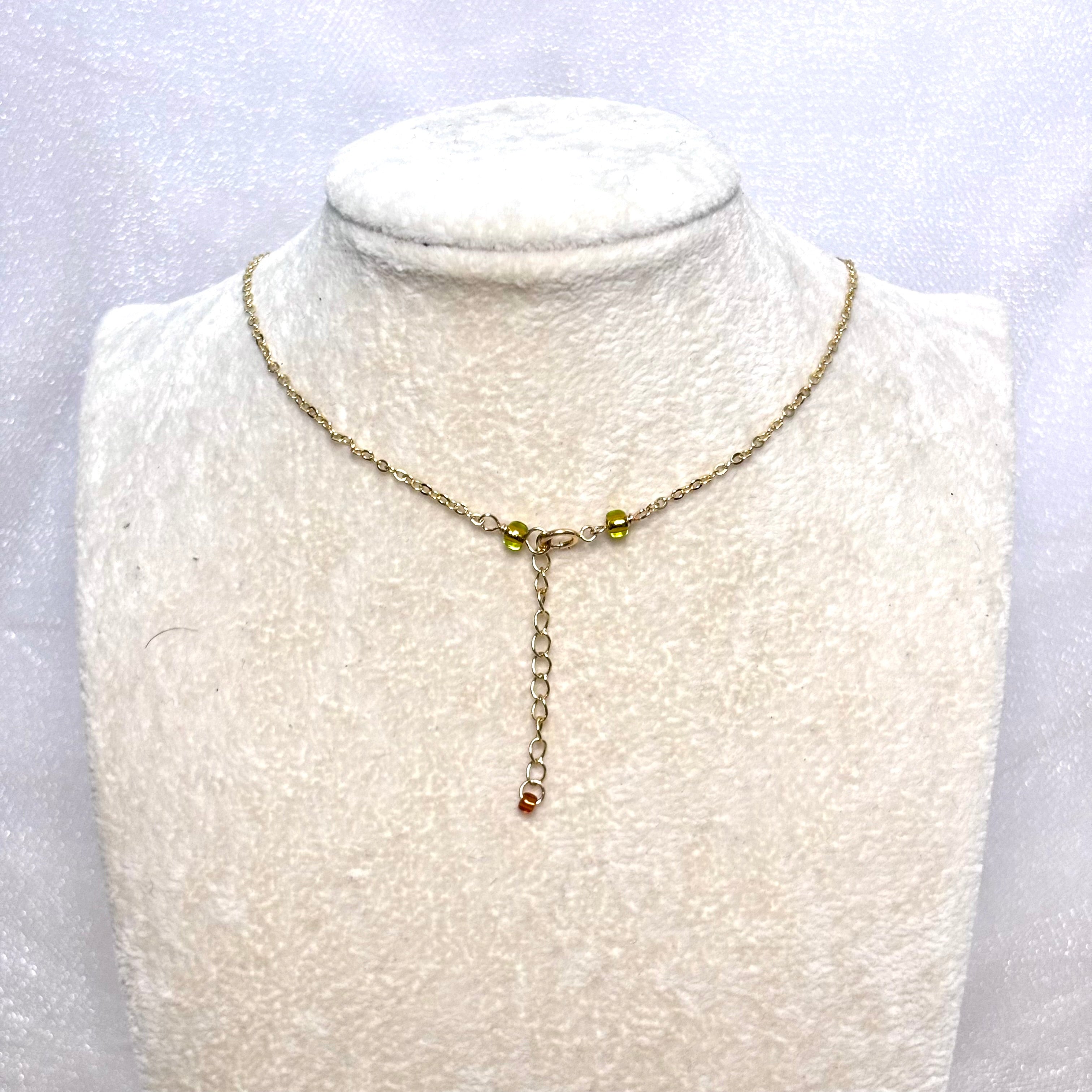 Cat cone shell Necklace w/ green pearls