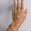 Cone shell handchain w/ white pearls