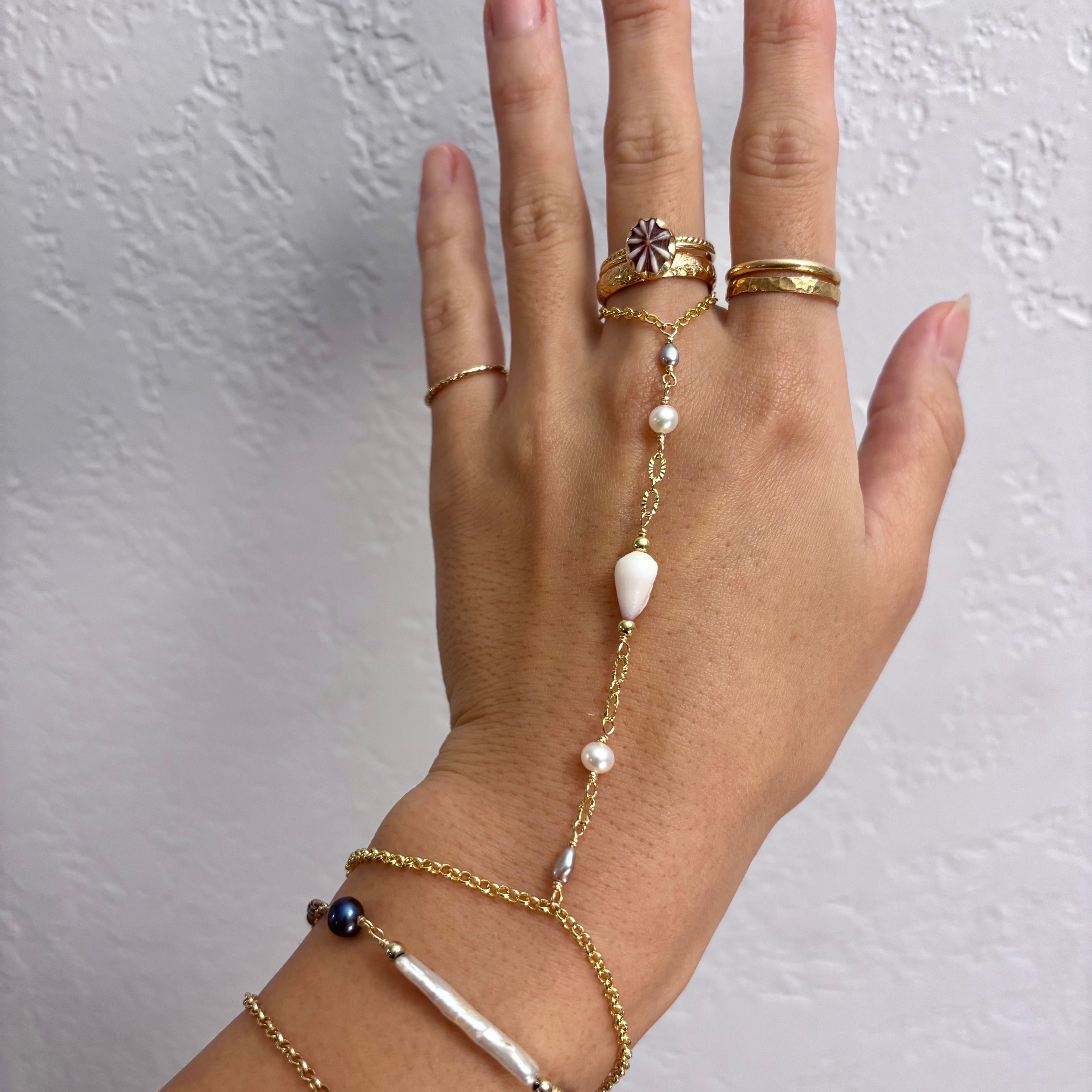 Cone shell handchain w/ white pearls